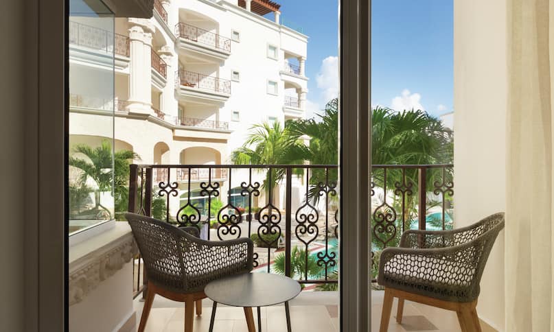 Balcony with Seating Area and Pool View-next-transition