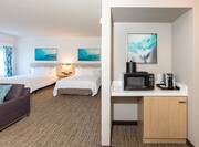 Microwave Coffeemaker and Guest Room with Two Beds in Hotel Room