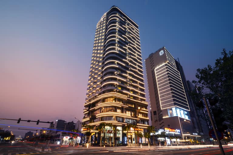 Exterior of hotel building at sunset
