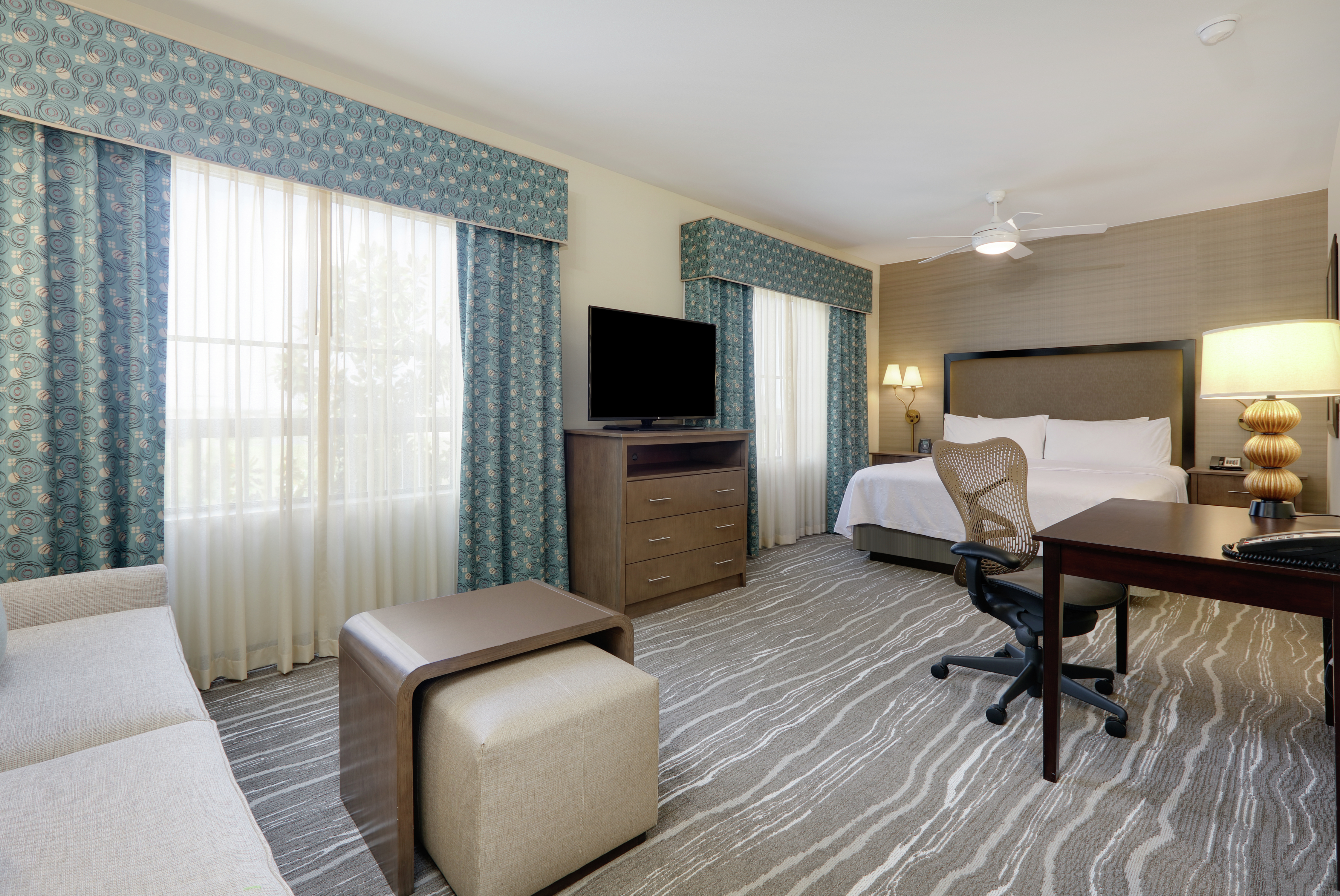 Seating and King Bed in Studio Suite