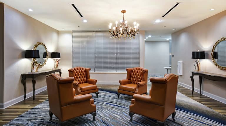Pre-function Sitting Area with Lounge Chairs and Elegant Furnishings