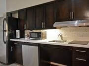 Full Kitchenette with Appliances and Amenities