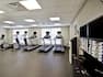 Fitness Center with Workout Equipment and Amenities 