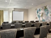 Meeting Room with Projection Screen and Classroom Style Setup