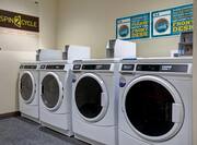 guest laundry with multiple washing machines