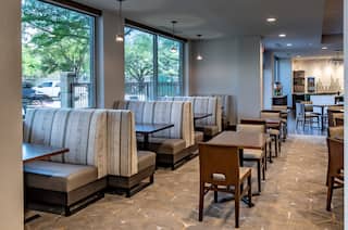 Booth Seating by Large Windows, Tables, and Chairs in Urban Mustang Restaurant Seating 