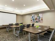 Meeting Room with Classroom Setup and Projection Screen