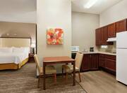 Accessible Suite with King Bed, Dining Table, and Kitchen