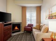 Accessible Suite Lounge Area with Fireplace and TV