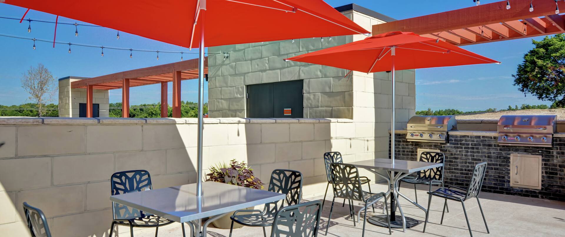 Outdoor patio with seating and grills