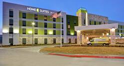 Home2 Suites Building Exterior with Shuttle