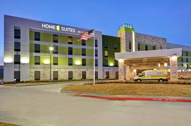 Home2 Suites Building Exterior with Shuttle