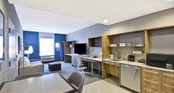 Accessible Queen Guestroom Suite with Room Technology, Work Desk, Kitchenette, and Lounge Area