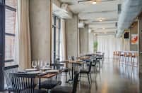 Loft Restaurant Dining Area with Large Windows