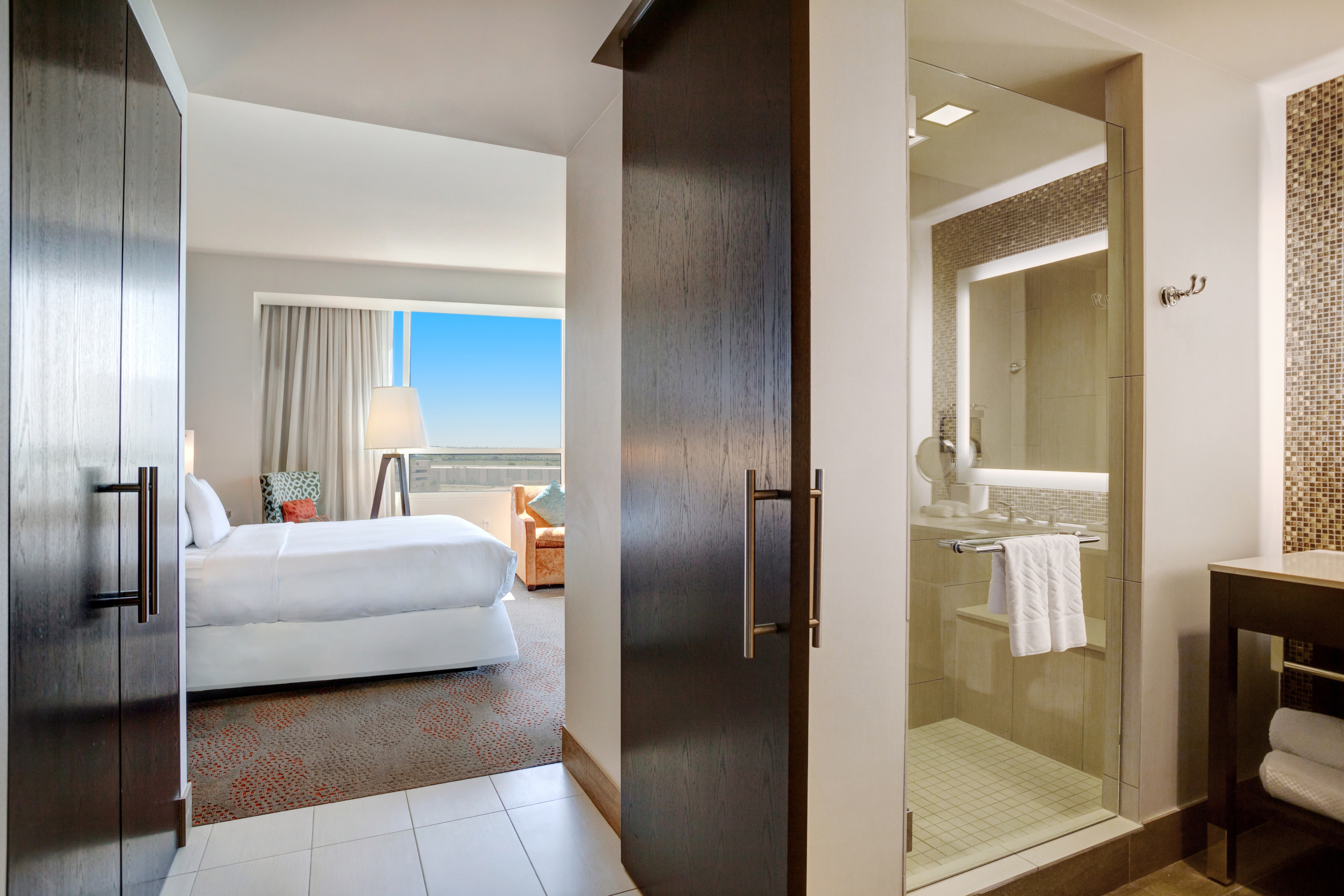 king bedroom with view of bathroom shower