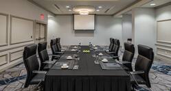 Boardroom with Meeting Table, Office Chairs and Projector Screen