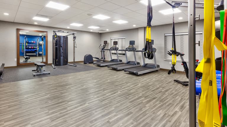 on-site fitness center treadmills, free weights