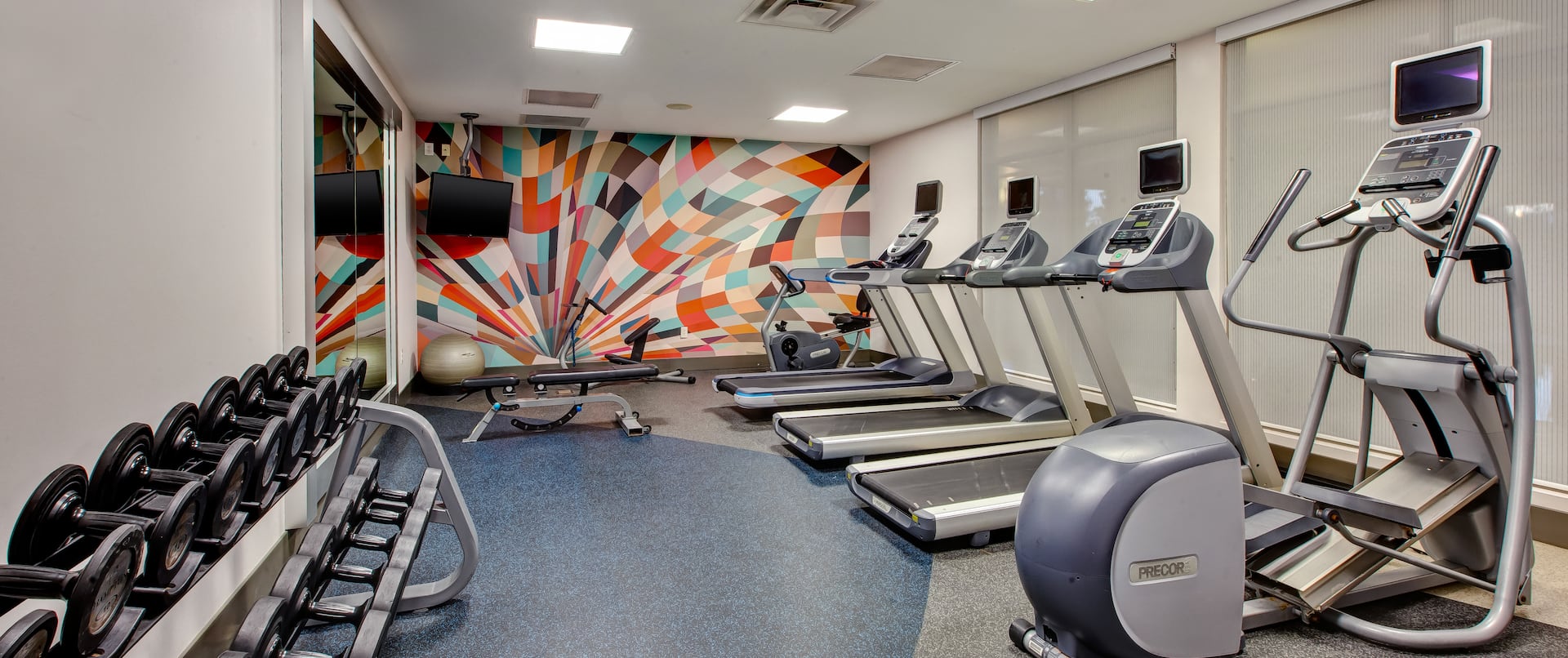 on site fitness center, treadmills, elliptical, free weights