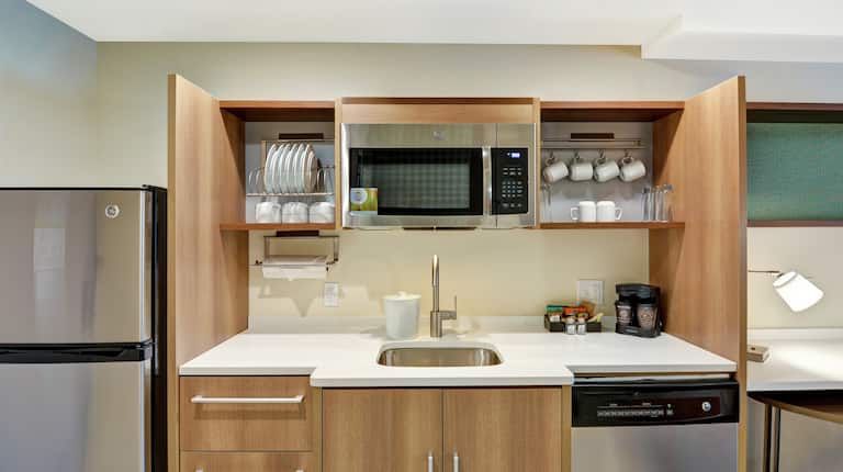 Kitchenette With Fridge  Microwave., Sink, and Dishwasher