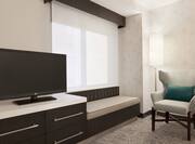 Guestroom with Television and Chair