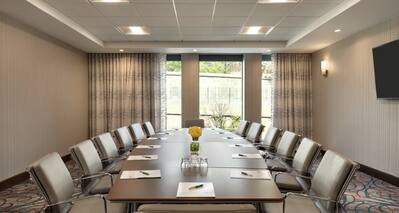 Meeting room with long table and chairs