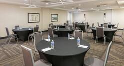 Meeting Room Setup with Round Tables and Chairs