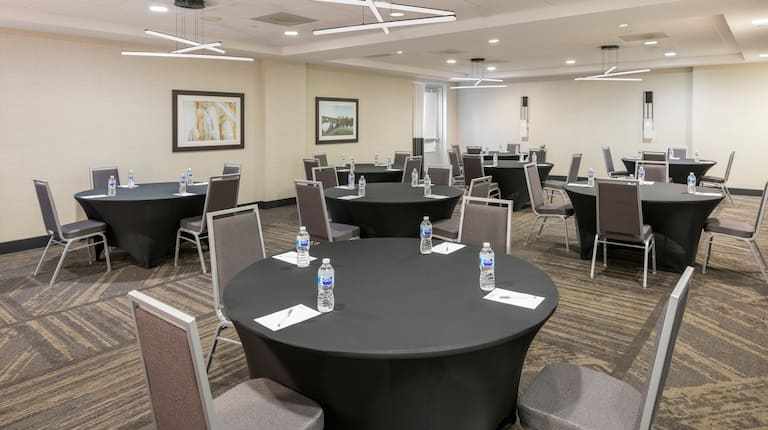 Meeting Room Setup with Round Tables and Chairs