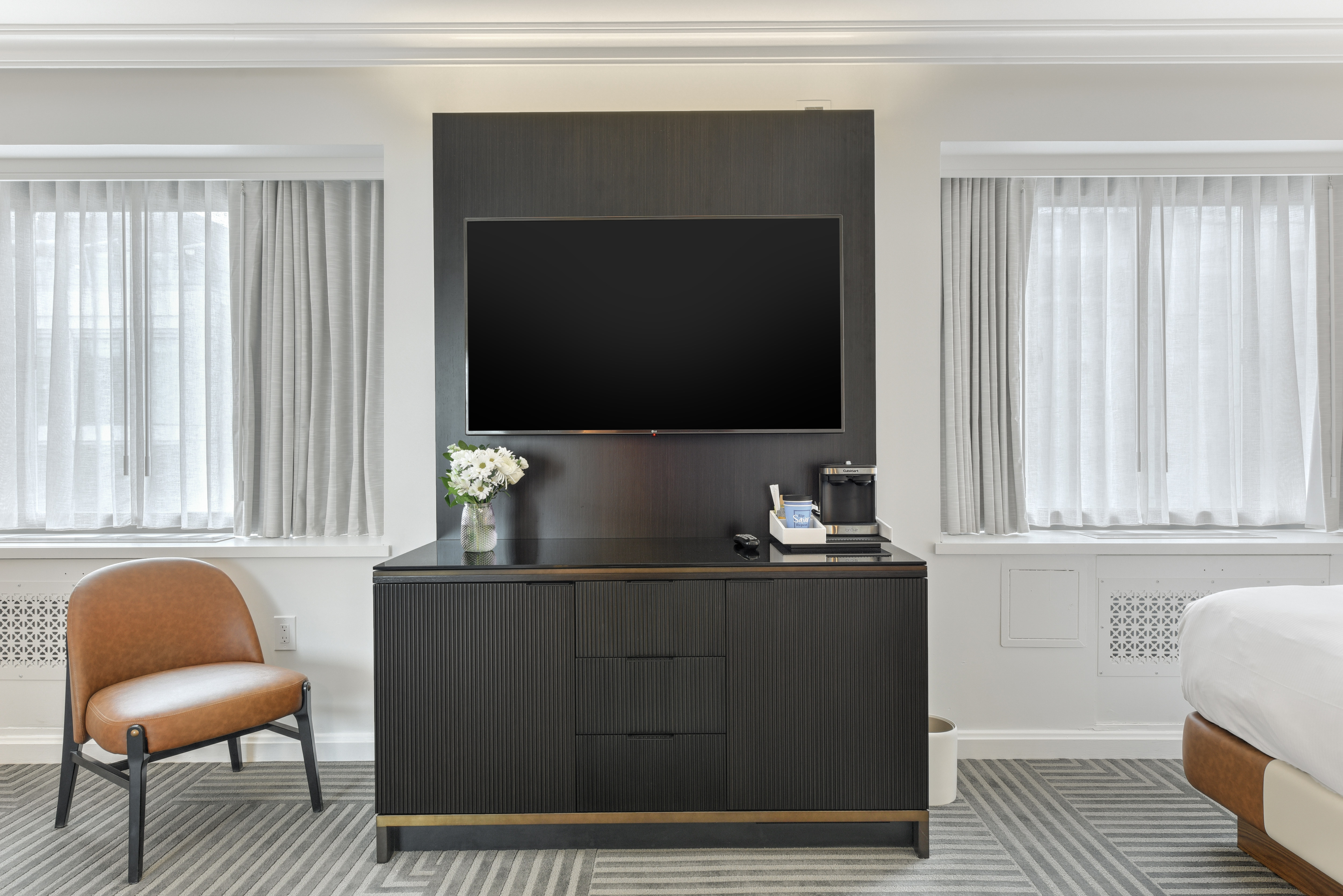 HDTV, Chair and Amenities in a Guest Room