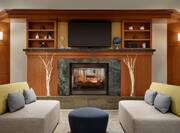 Lobby Seating Area with Fireplace, Soft Seating and Wall Mounted TV