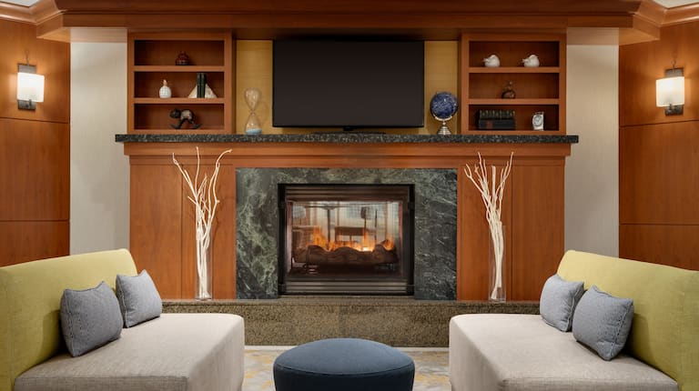 Lobby Seating Area with Fireplace, Soft Seating and Wall Mounted TV