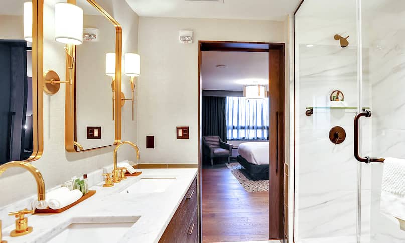 Chief of State Guest Bathroom with Dual Vanity Area and Shower with Sliding Glass Doors-previous-transition