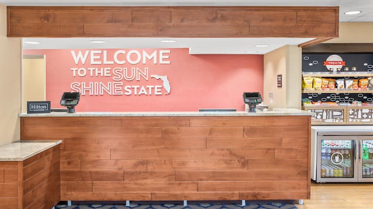 Welcome to the Sunshine State Signage at Hotel Front Desk