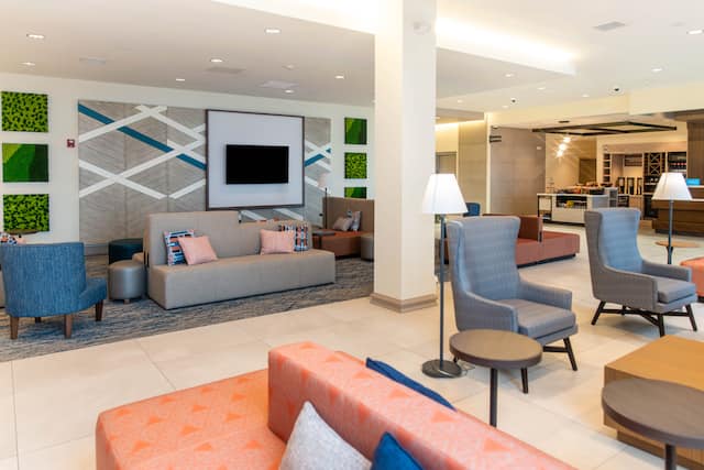 Lobby Area with HDTV Sofas and Comfortable Chairs