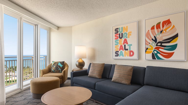Bright lounge area with comfortable seating and gorgeous partial Oceanview