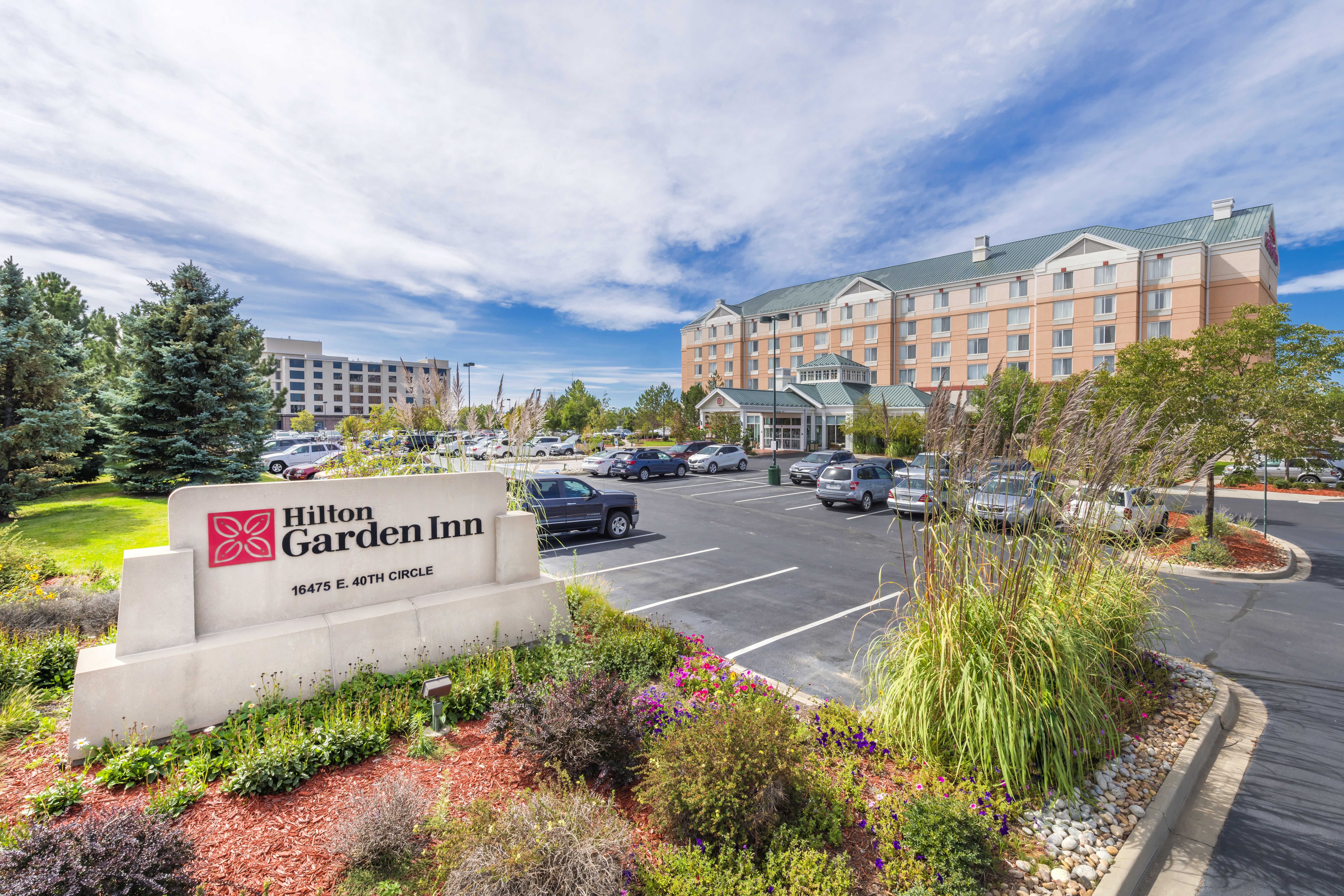 Daytime View of Hotel Exterior, Hilton Garden Inn Sign and Parking