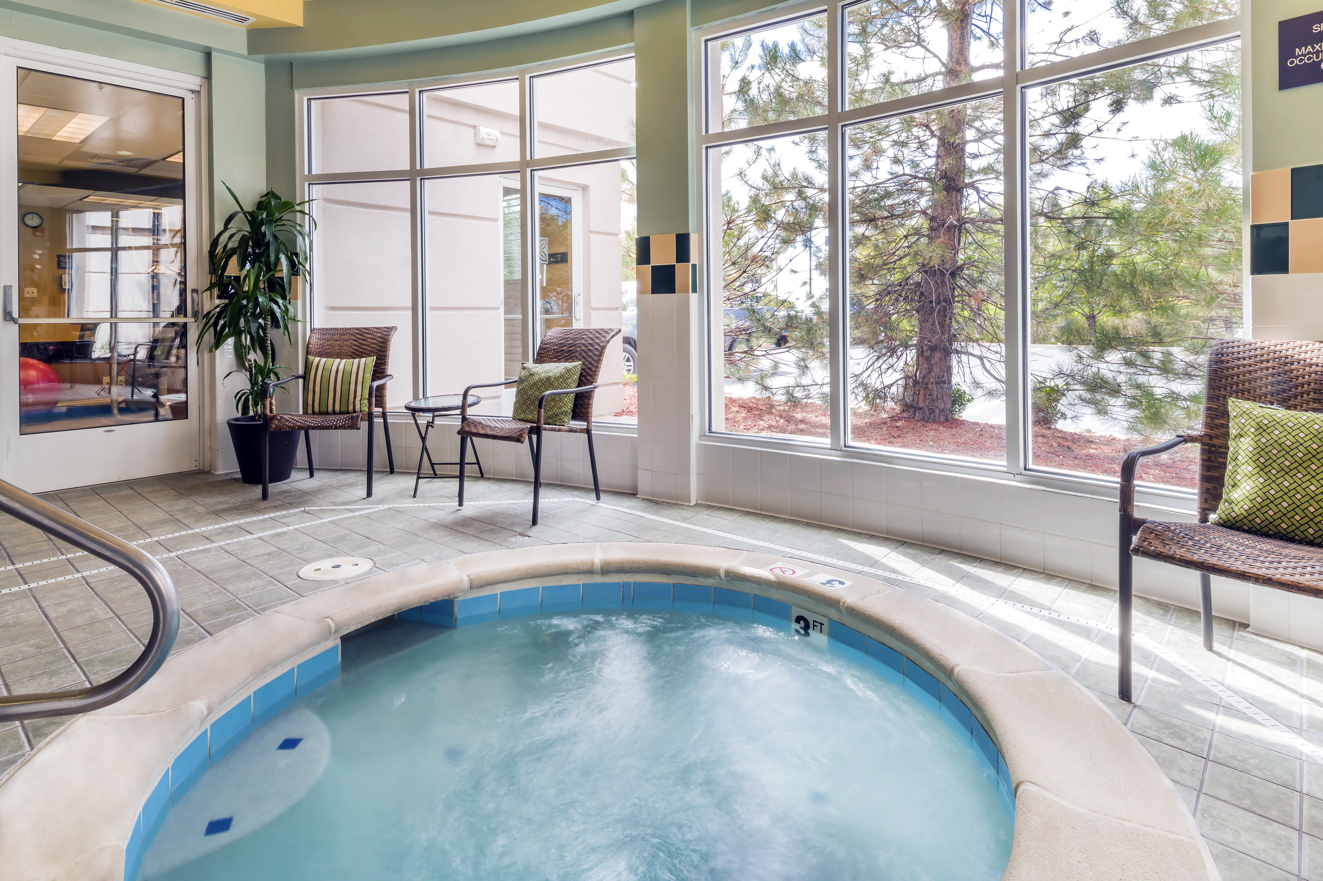 Indoor Whirlpool with View Out Windows in Daytime