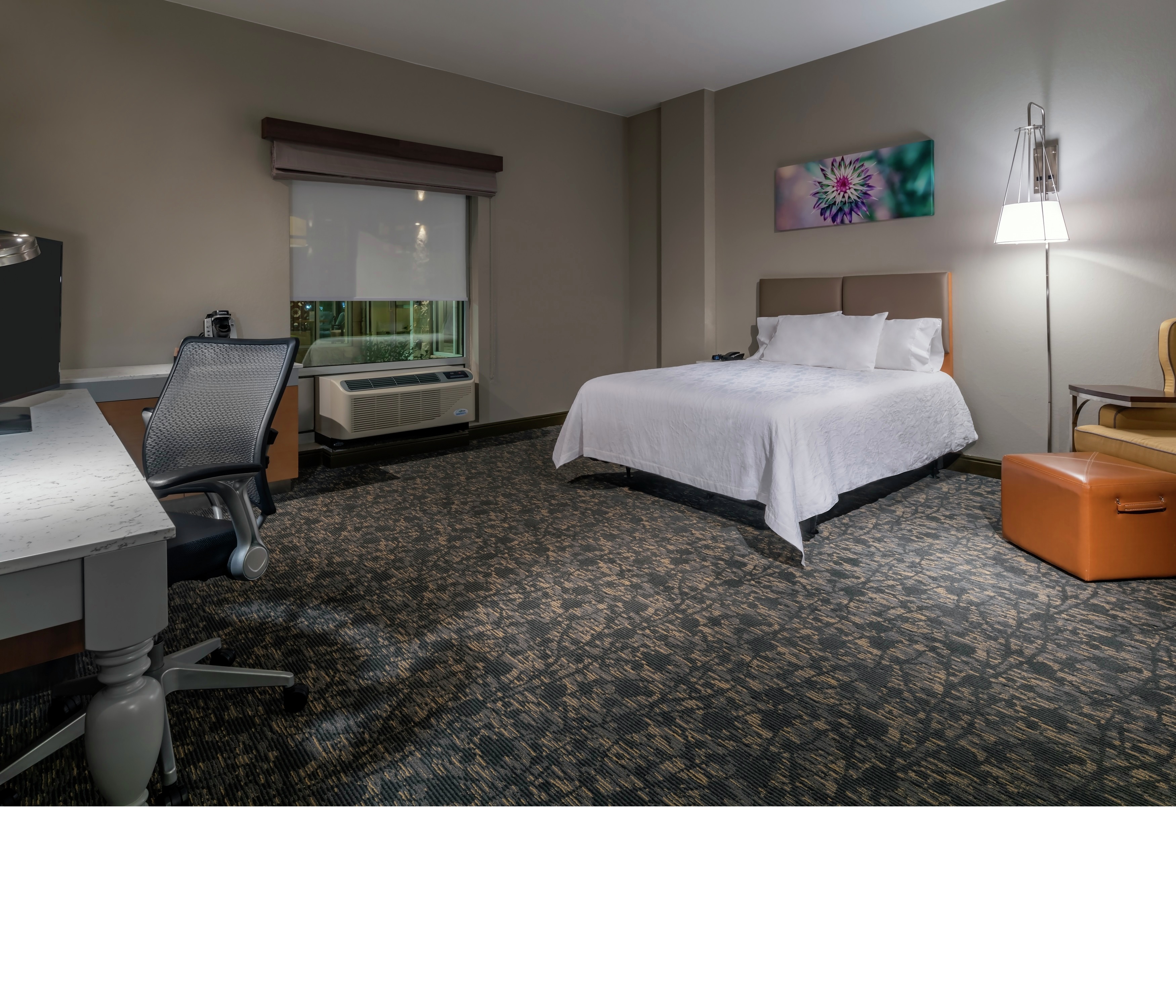 Accessible Queen-Sized Guestroom with Work Desk, Lounge Area, and Room Technology