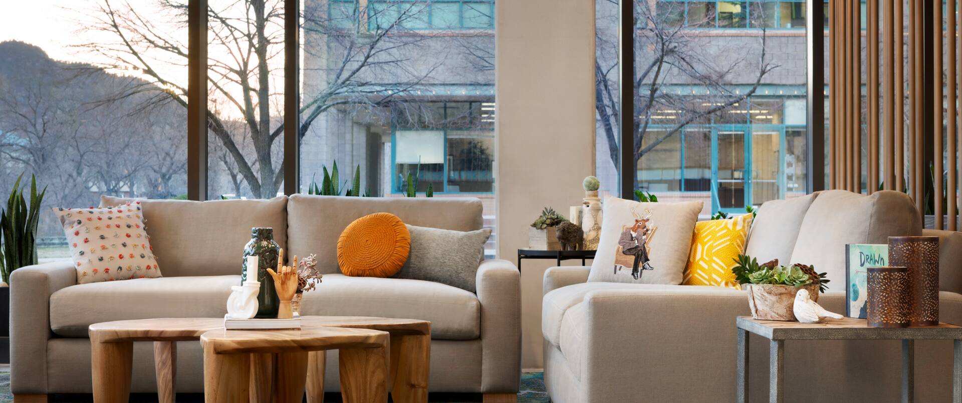 Sofa Couches, Wooden Coffee Tables and Mountain Views in our Atrium Lobby
