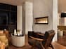 Bar Lounge Seating Arae with Fireplace, Sofa, Coffee Table and Armchair