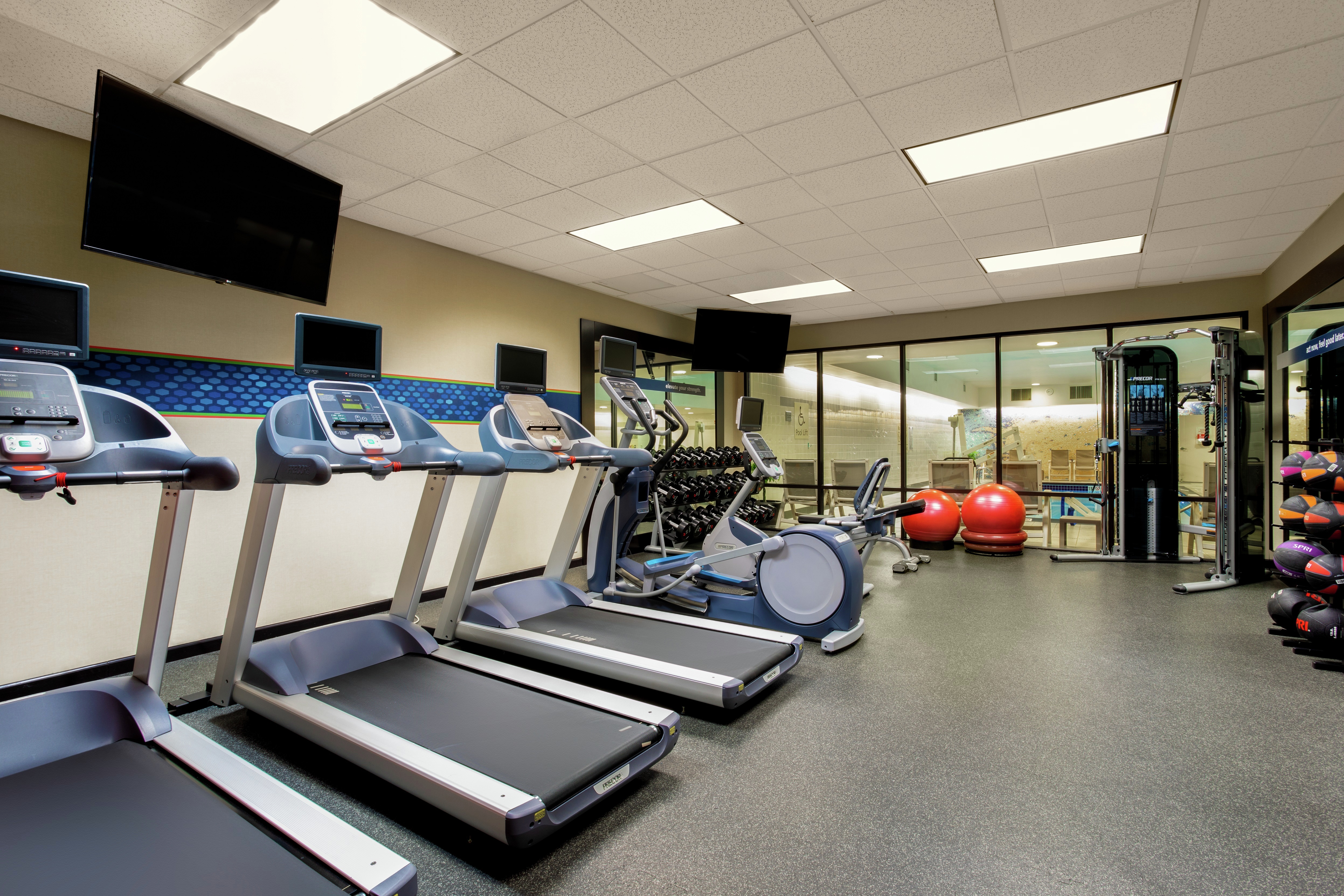Fitness Center with Treadmills, Cross-Trainer and Wall Mounted HDTV
