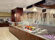 Breakfast Buffet With View of Beverage Area, Toast, Pastries, Fruit, and Yogurt