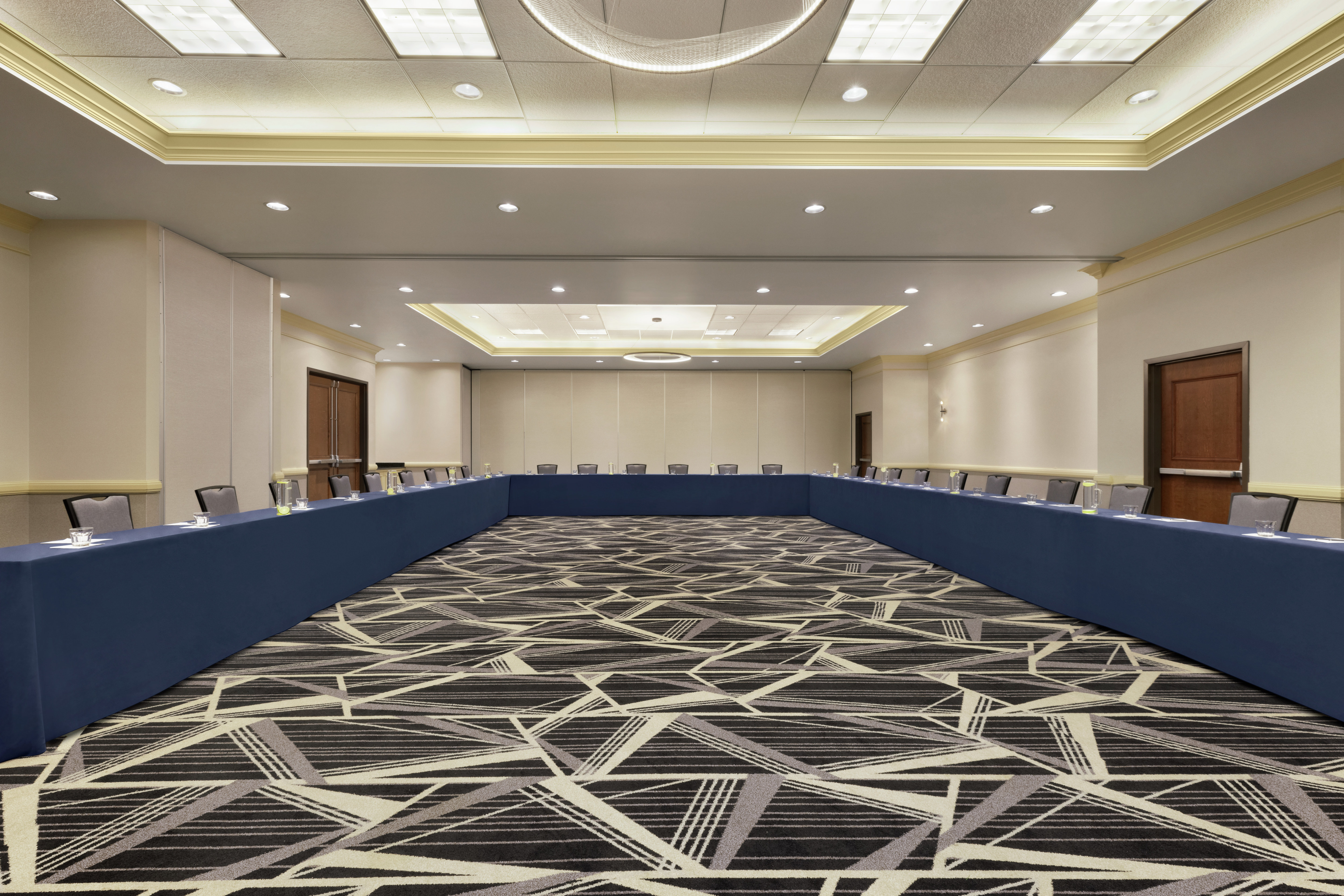 Spacious on-site bathroom fully equipped with large u-shape conference setup for corporate events and functions.