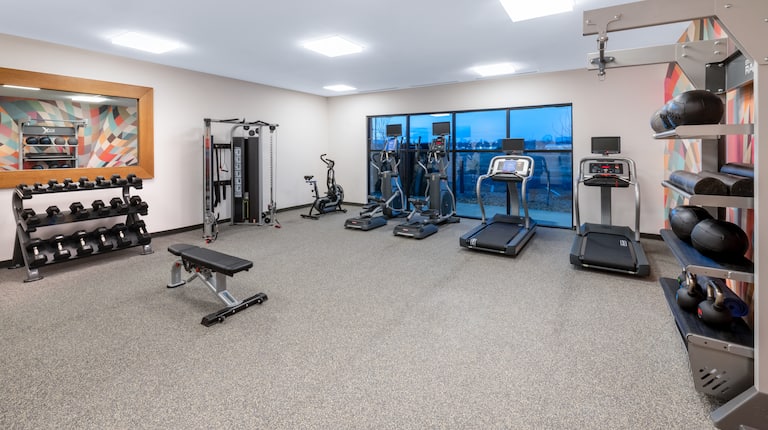 Fitness Center with Treeadmills Exercise Bikes and Weights