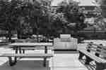 Patio featuring a picnic table and a grill for guests to enjoy