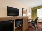 Guestroom with Work Desk, Television, Mini Fridge and MIcrowave