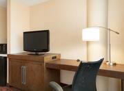 Guestroom with Work Desk, Television, Microwave and Mini Fridge