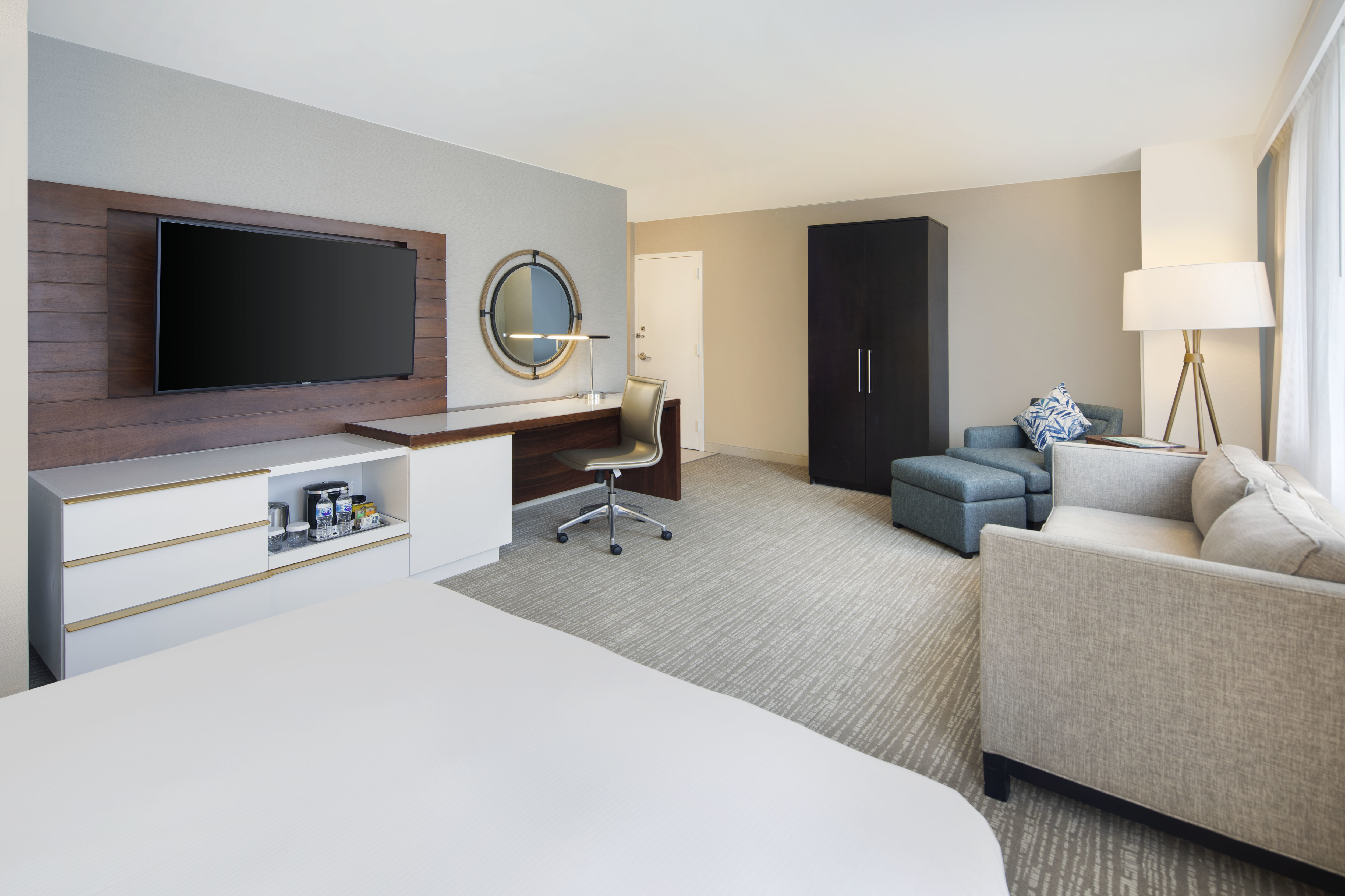King Junior Suite Lounge Area with HDTV Work Desk and Armchair