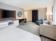 King Junior Suite Lounge Area with HDTV Work Desk and Armchair