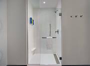 guest bathroom with standard shower