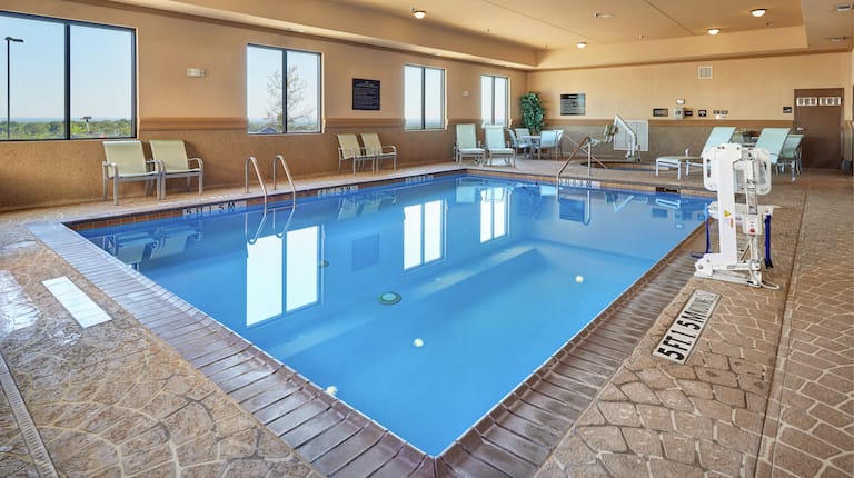 Indoor pool with poolside seating